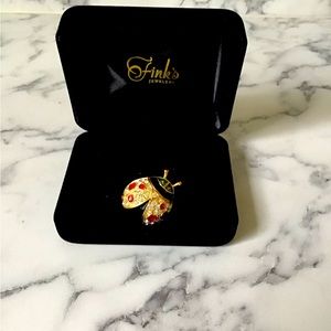 Joan Rivers ladybug brooch